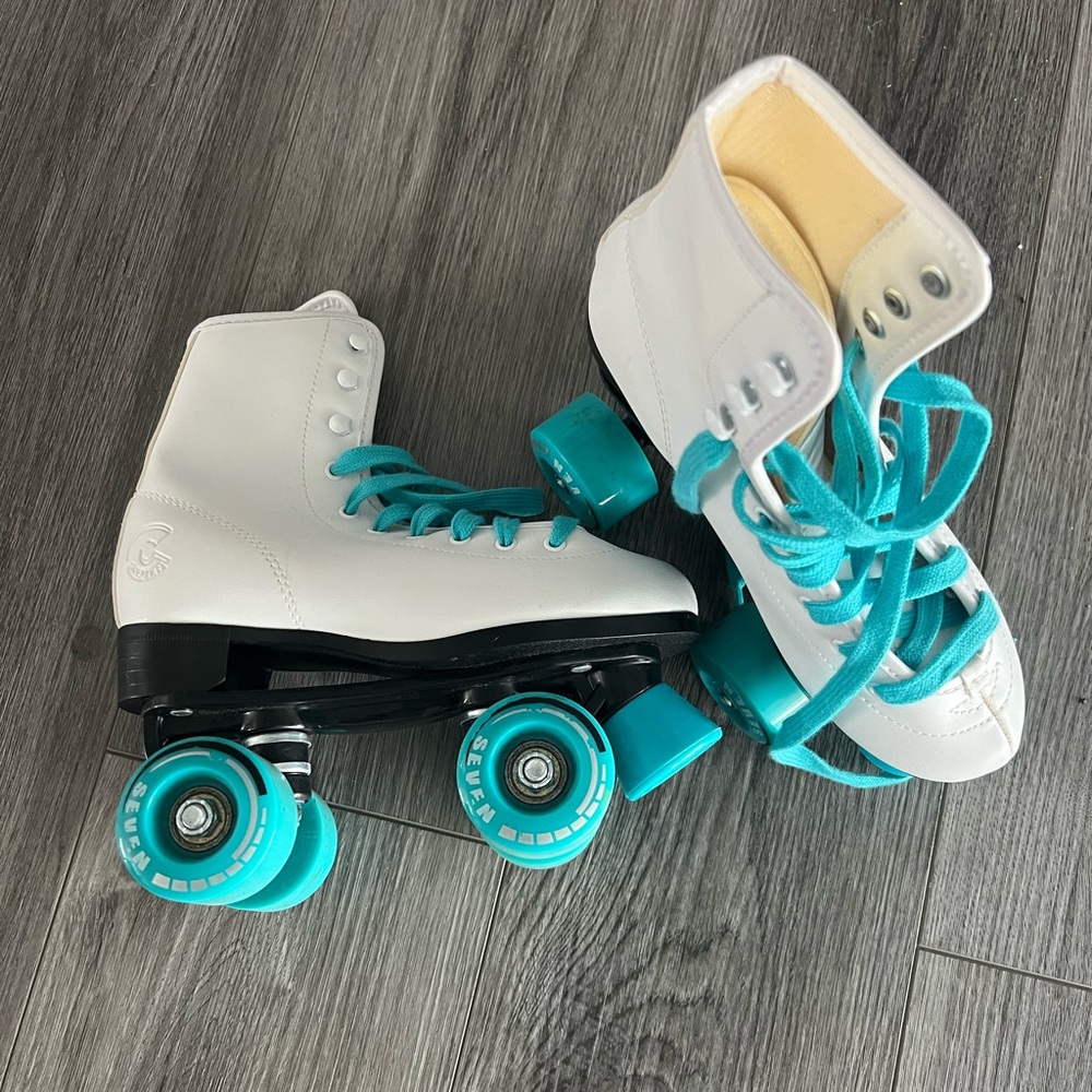 Girls size 3 Roller Skates White w/ teal wheels. Only worn a hand full of times
